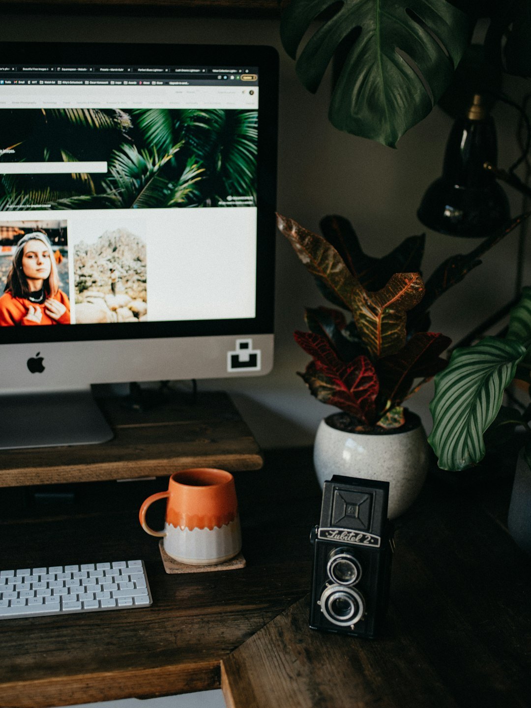 Cozy editorial studio office with desk and camera