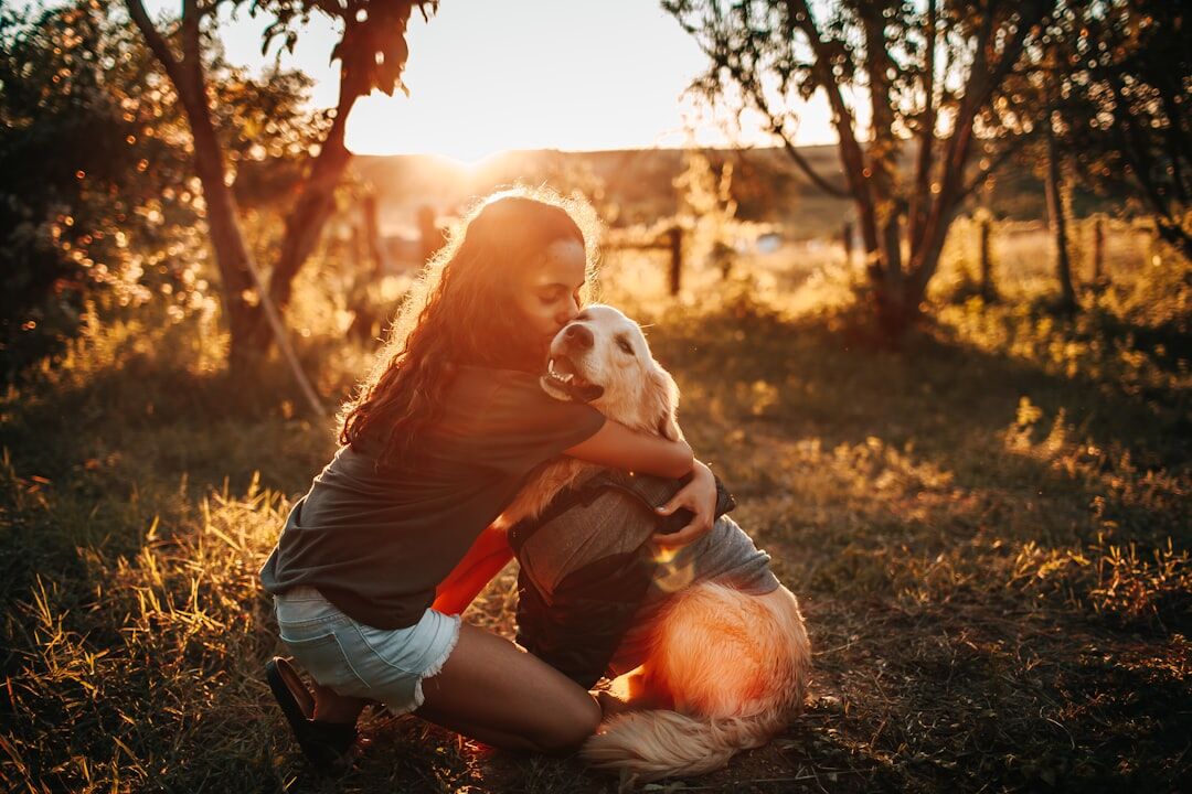 woman with dog at sunset