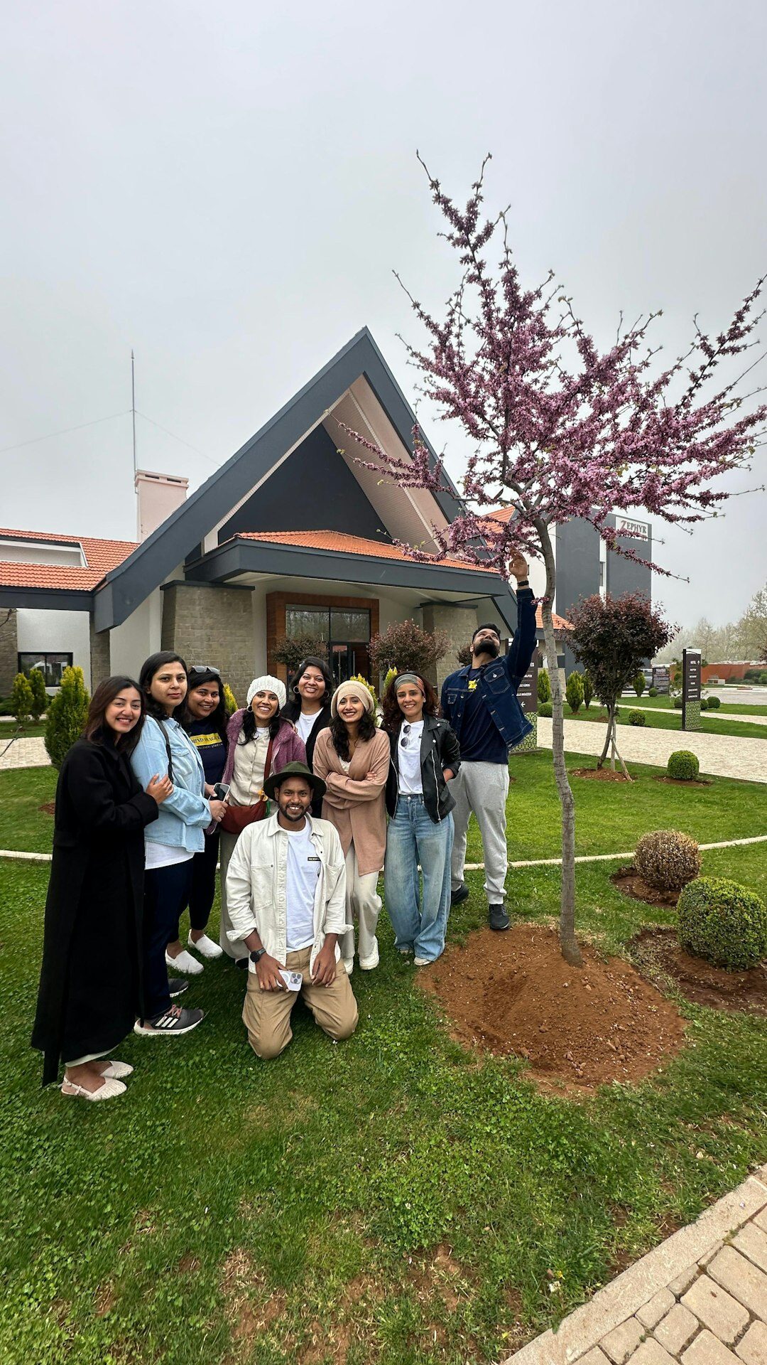 family planting trees